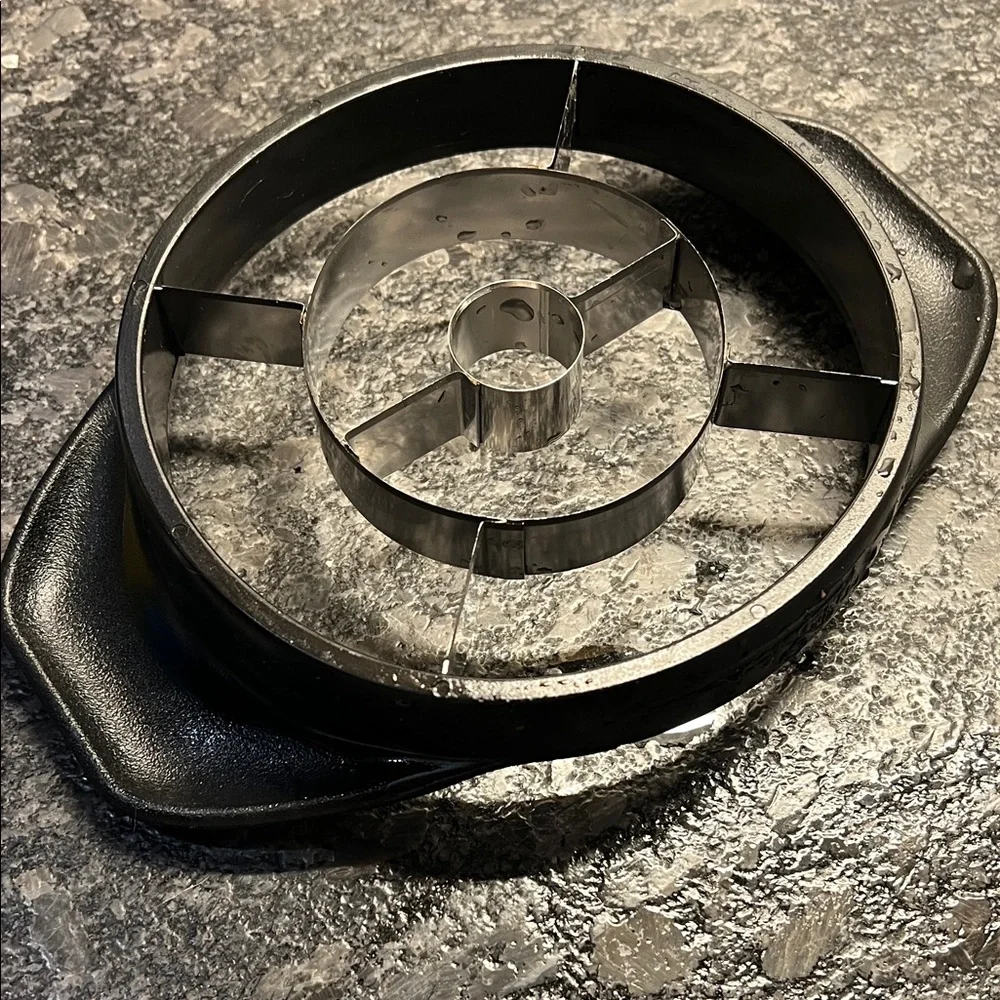 Pampered Chec Black and Silver Pineapple Slicer with protective cover.